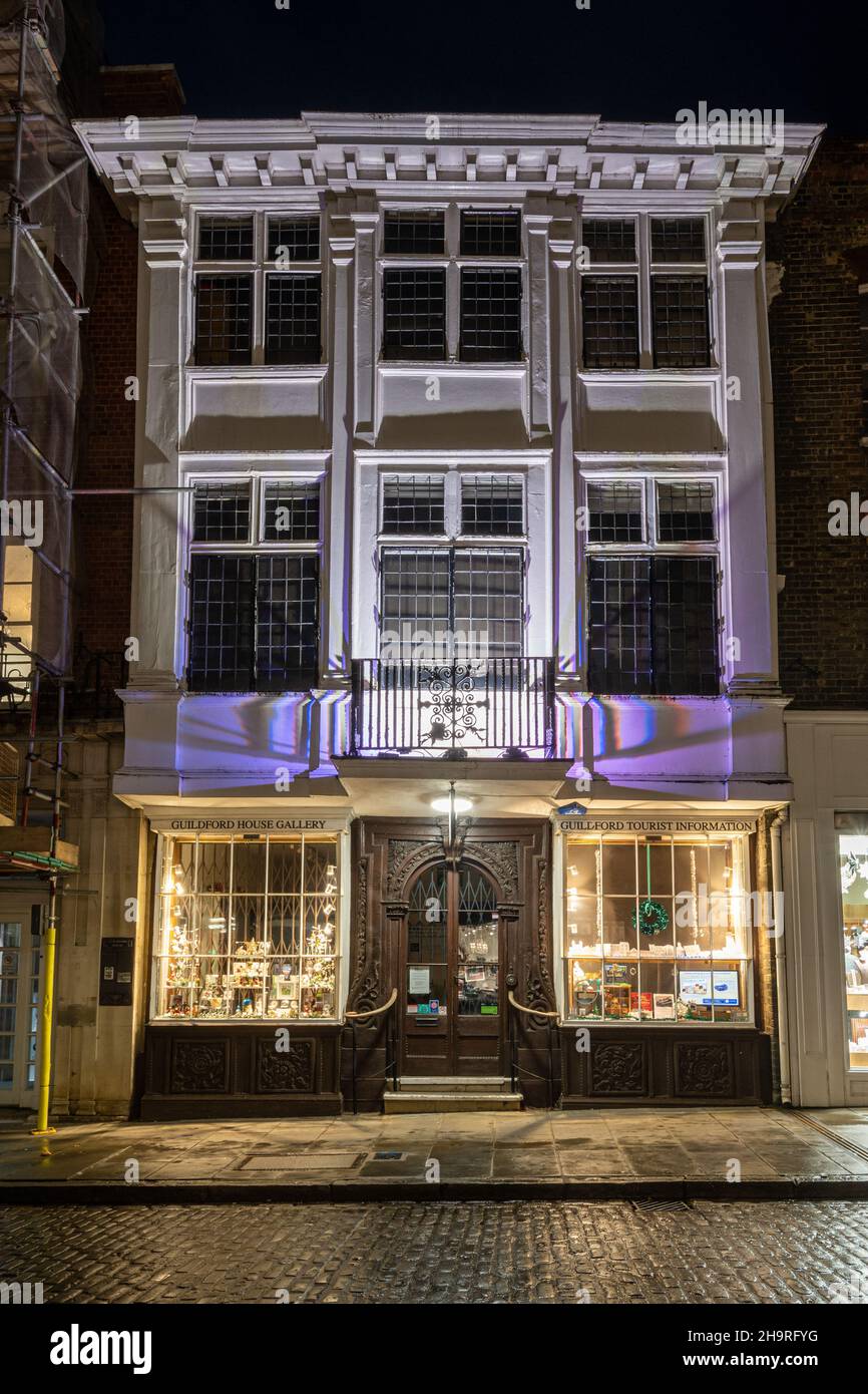 Guildford House Gallery and tourist information facility on the High Street in Guildford, Surrey, UK, at night Stock Photo