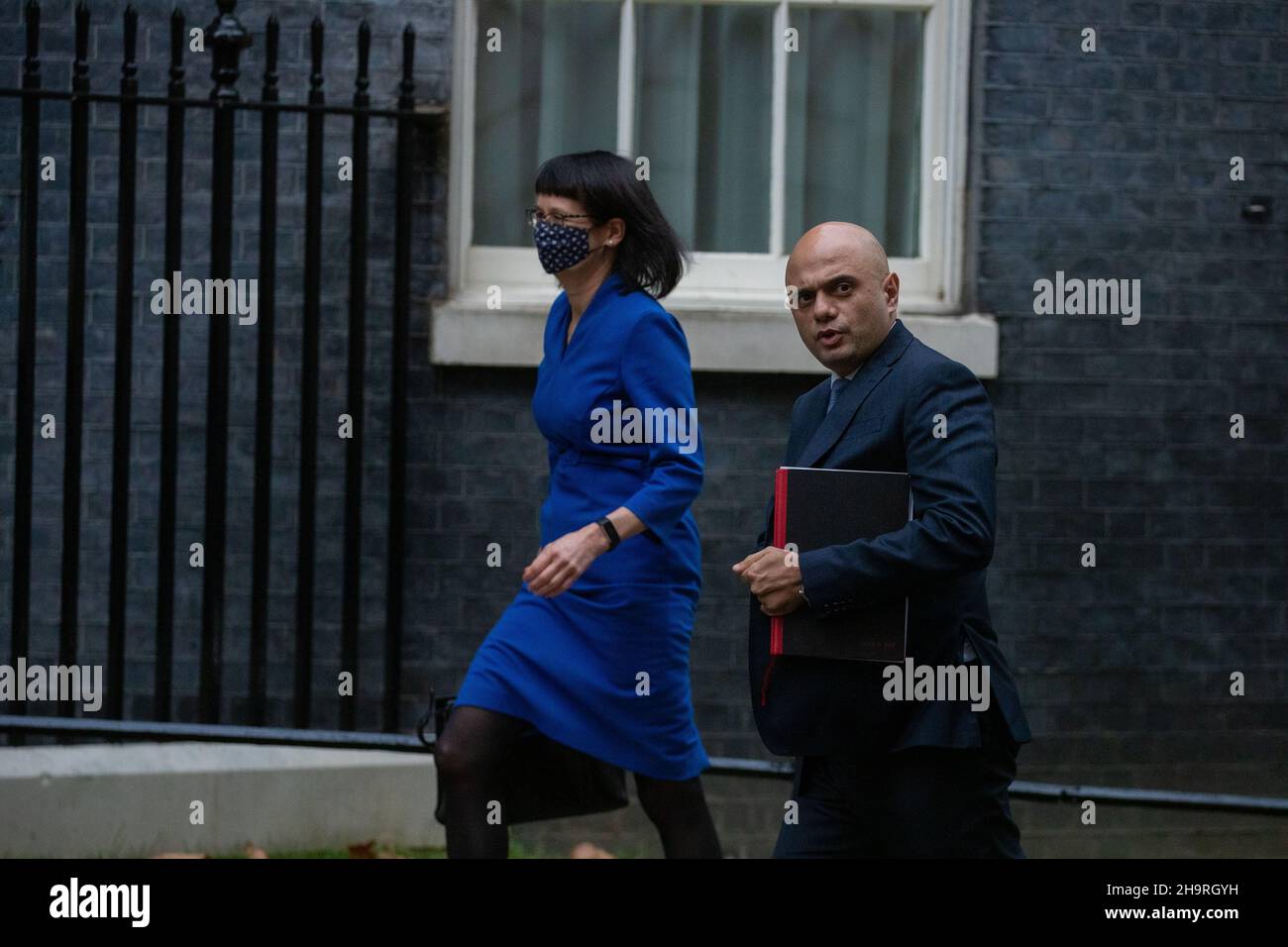 LONDON, UK 8TH DECEMBER 2021. Sajid Javid the Secretary of State for Health and Social Care and Jenny Harries the Deputy Chief Medical Officer arrives at 10 Downing Street ahead of Covid-19 briefing Credit: Lucy North/Alamy Live News Stock Photo