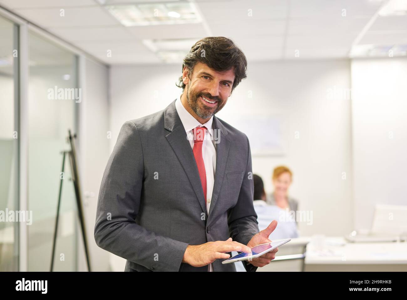 Business man as a manager with competence and experience on the tablet computer Stock Photo