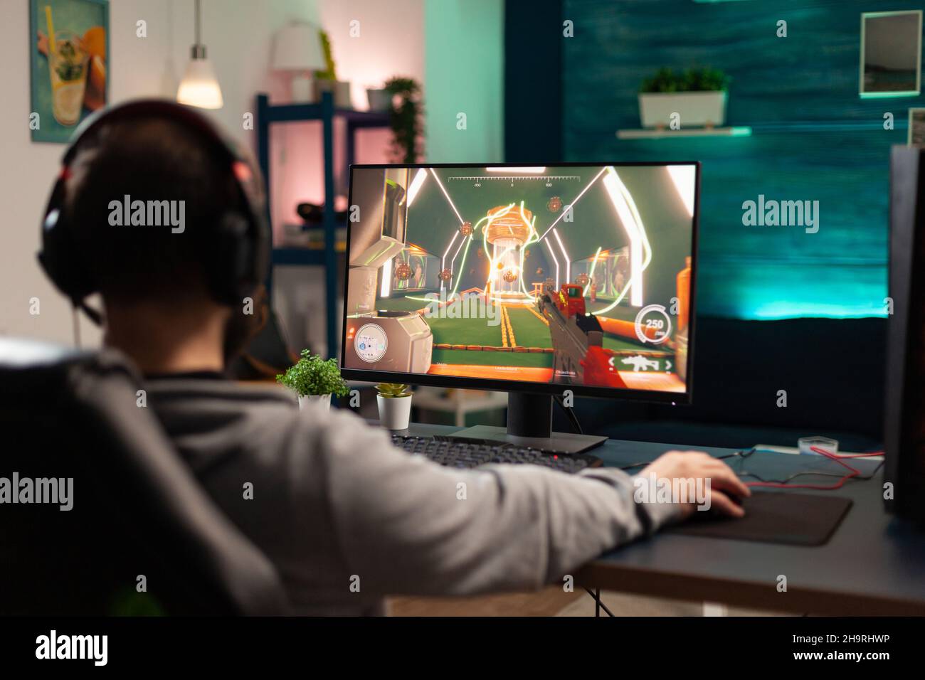 Gamer using controller to play online video games on computer. Man playing  game with joystick and headphones in front of monitor. Player having gaming  equipment, doing fun activity Stock Photo - Alamy