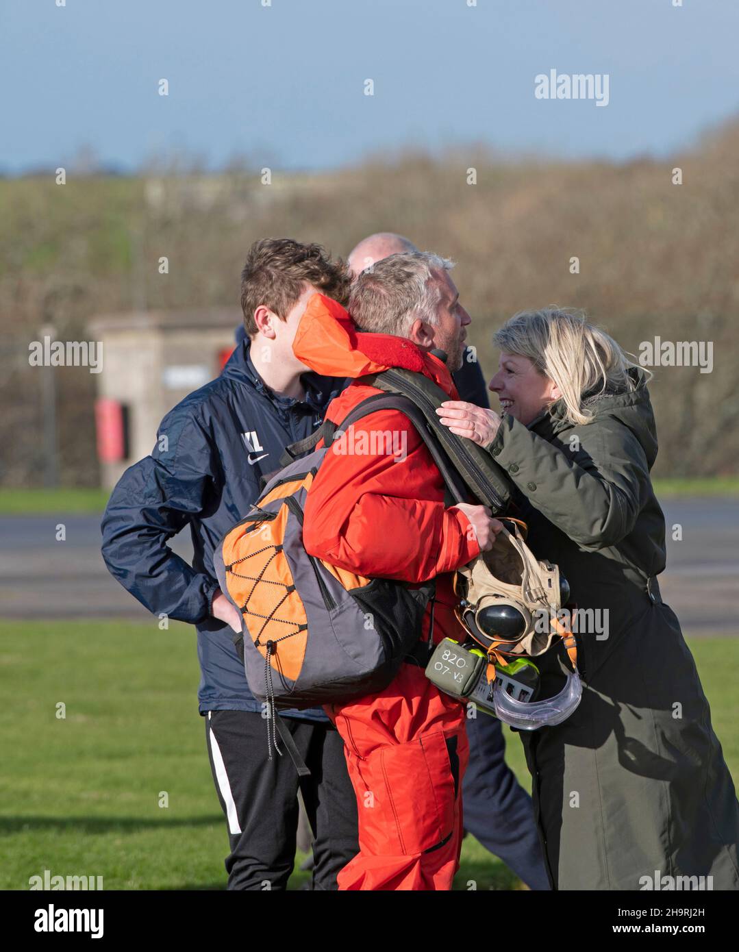 Families from 820 squadron re-unite after returning to the air station at Helston in Cornwall, today with their seven Merlin Mk2 helicopters, were around 60 aircrew and engineers from the squadron while the others have returned separately. The Carrier Strike Group 2021 has included nine ships from various allied countries, one submarine, 32 aircraft and more than 3,700 personnel. The deployment has been a significant milestone in establishing the UK's global capability to operate F35 jets as part of the UK's conventional deterrent. Stock Photo