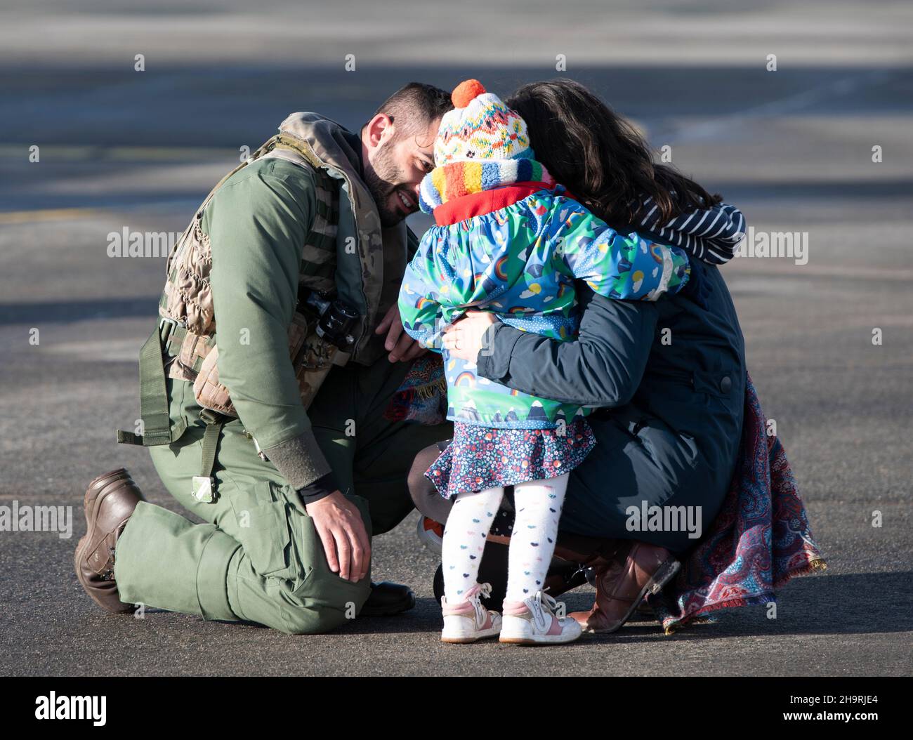 Families from 820 squadron re-unite after returning to the air station at Helston in Cornwall, today with their seven Merlin Mk2 helicopters, were around 60 aircrew and engineers from the squadron while the others have returned separately. The Carrier Strike Group 2021 has included nine ships from various allied countries, one submarine, 32 aircraft and more than 3,700 personnel. The deployment has been a significant milestone in establishing the UK's global capability to operate F35 jets as part of the UK's conventional deterrent. Stock Photo