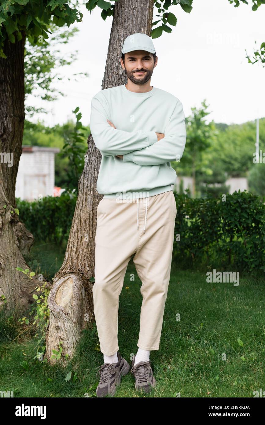 Pleased man crossed arms hi-res stock photography and images - Alamy