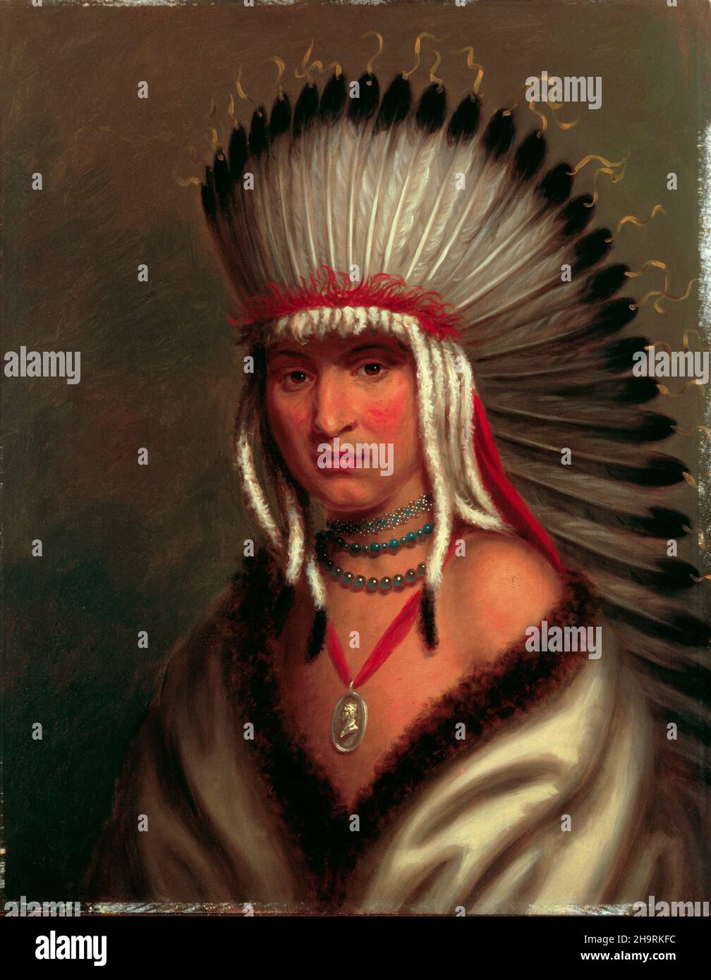 Petalesharro, a Pawnee Brave. 1822 painting by Charles Bird King. On display in the White House Library. His feather bonnet is likely the first ever painted by a white artist.Petalesharo (c. 1797 – c. 1836) was a Skidi Pawnee chief or brave who rescued an 'Ietan' girl, that is Comanche girl,[3]: 159  from a ritual human sacrifice around 1817 (in present-day Nebraska) and earned publicity for his act in national newspapers. In 1821, he was one of numerous Great Plains tribal chiefs to go to Washington, D.C. as part of the O'Fallon Delegation where they met President James Monroe. Stock Photo