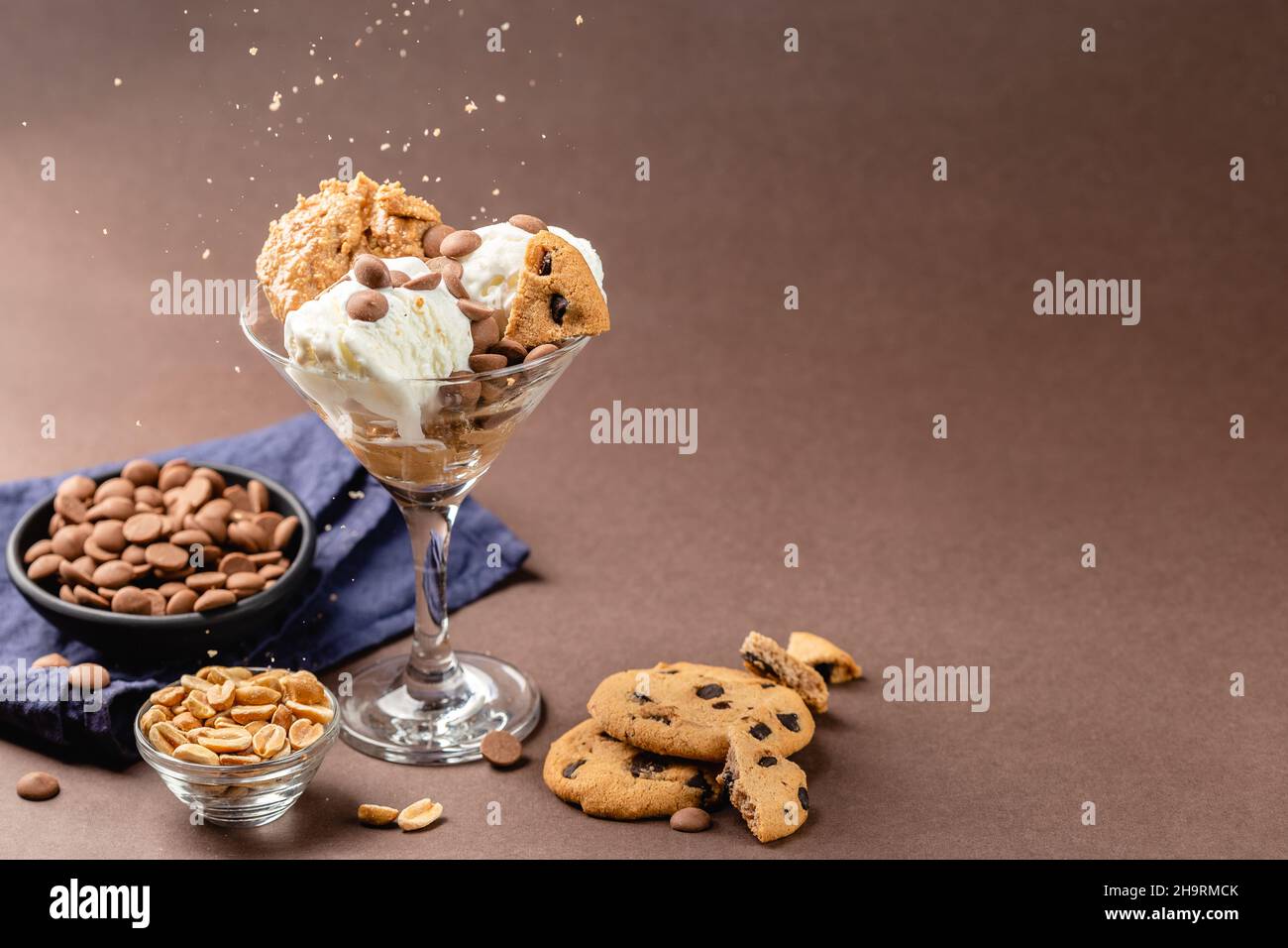 Homemade peanut butter ice cream with peanuts and chocolate cookies Stock Photo