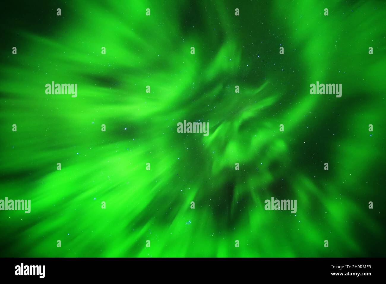 Magical upward shot of northern lights on starry sky. Stock Photo
