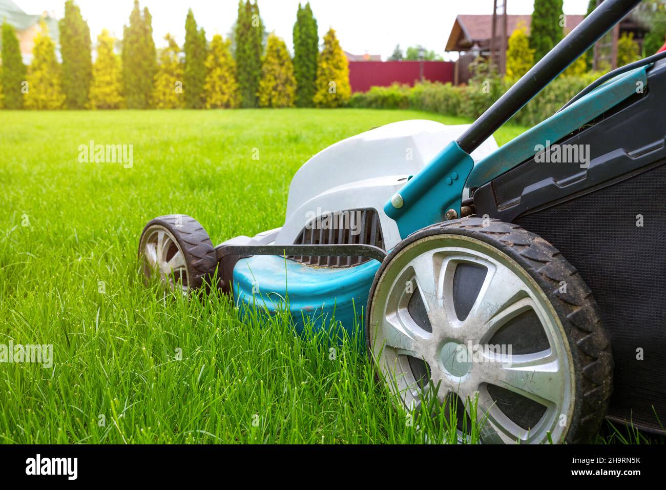 Lawn mowers close-up on a sunny day. Grass care. Gardening concept. Stock Photo