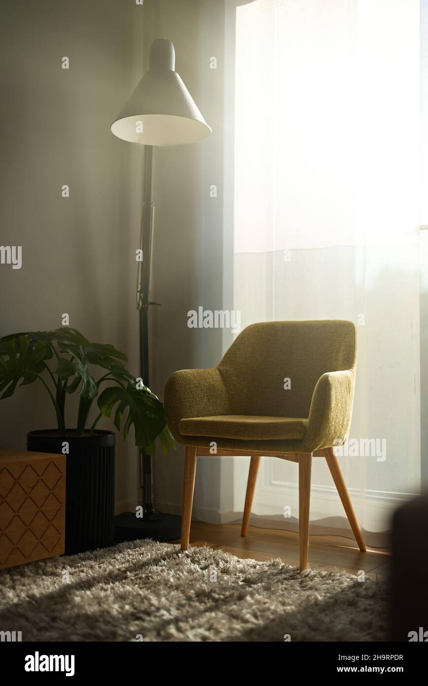 Armchair with lamp in morning. Scandinavian interior Stock Photo - Alamy