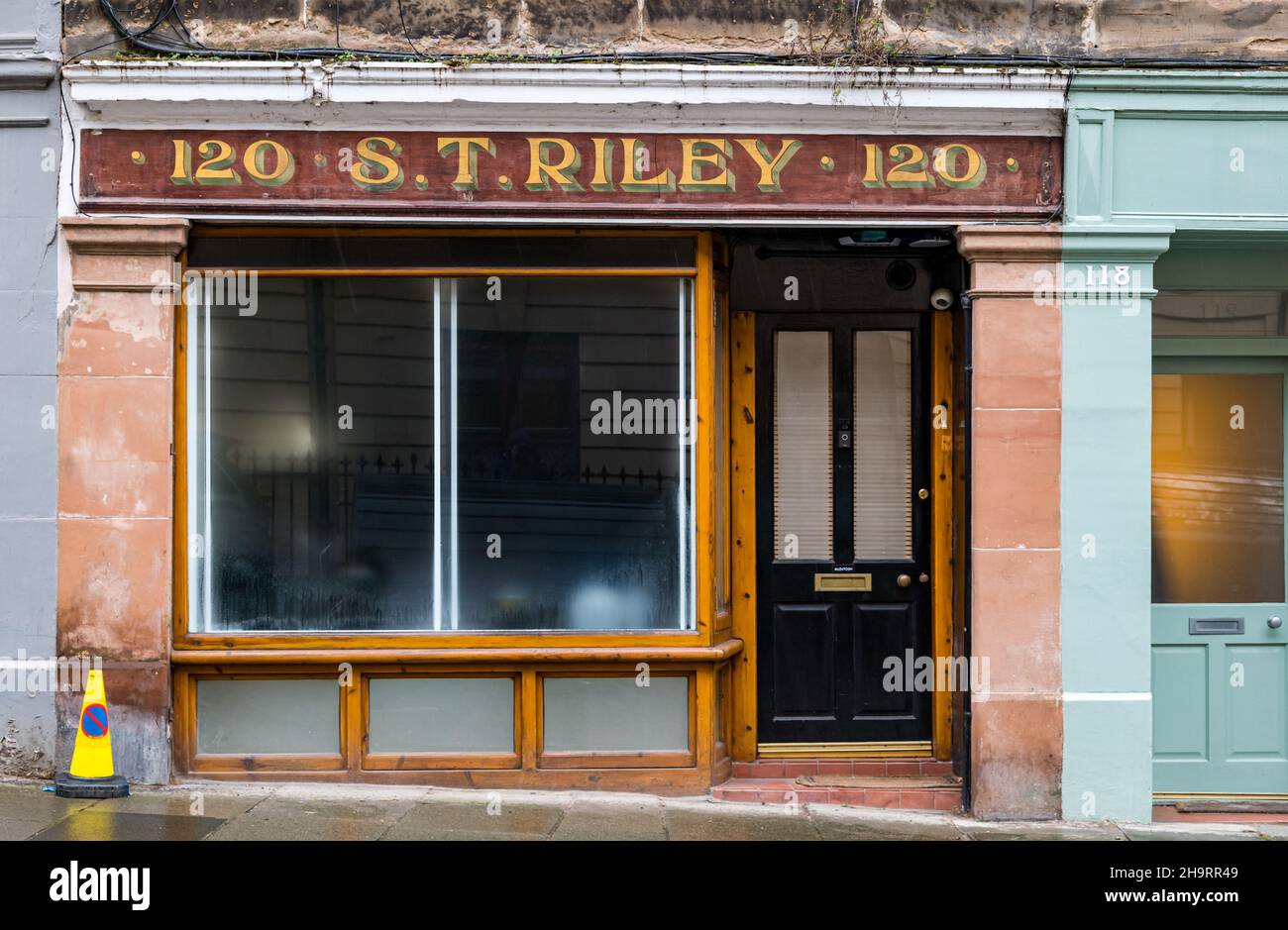 Old shop front with restored ghost sign, Stockbridge, Edinburgh, Scotland, UK Stock Photo