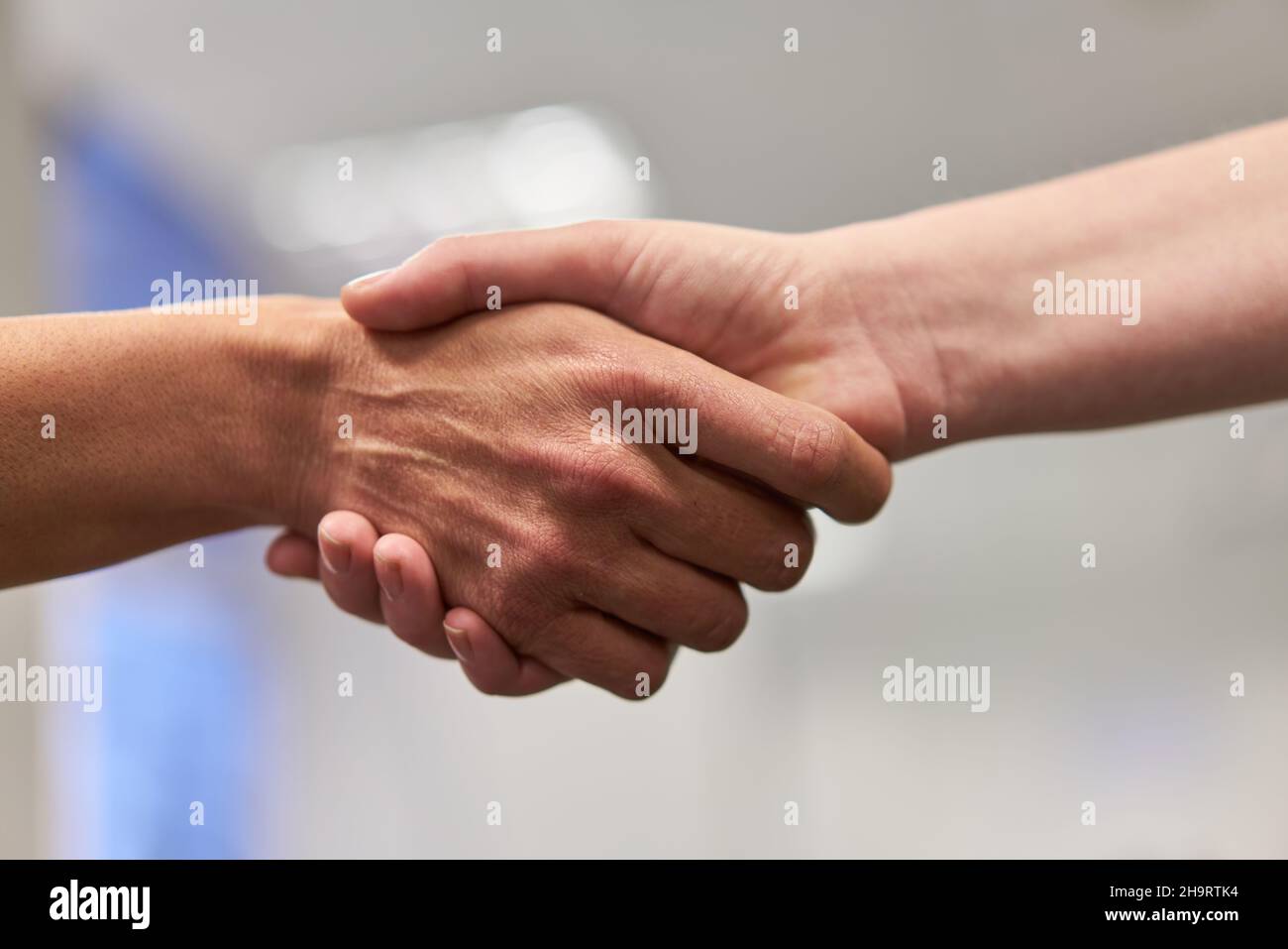 Business people at the handshake as a symbol for deal and cooperation Stock Photo