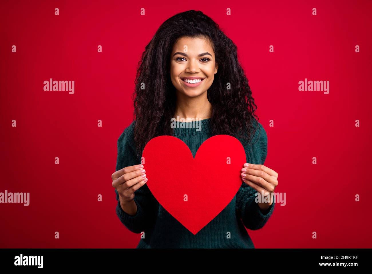 Photo of dreamy pretty dark skin lady wear green sweater showing big ...