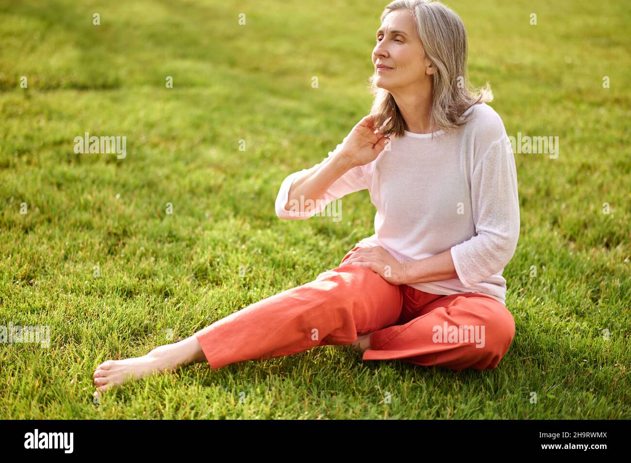 Mature woman barefoot outdoors hi-res stock photography and images - Alamy