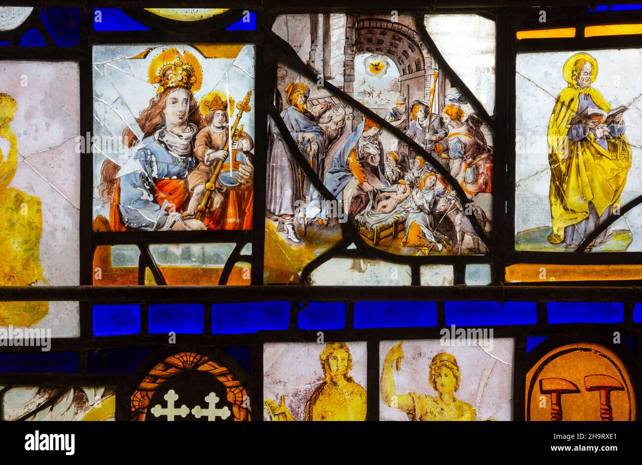Stained glass window arranged by Samuel Yarrington c 1830, includes 14th century English fragments, Herringfleet church, Suffolk, England, UK Stock Photo
