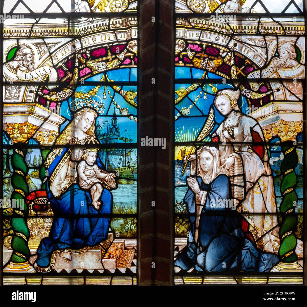 Renaissance Flemish style stained glass window of Blessed Virgin Mary and baby Jesus with two women, by J. Fisher c 1903, Barsham church, Suffolk, Eng Stock Photo