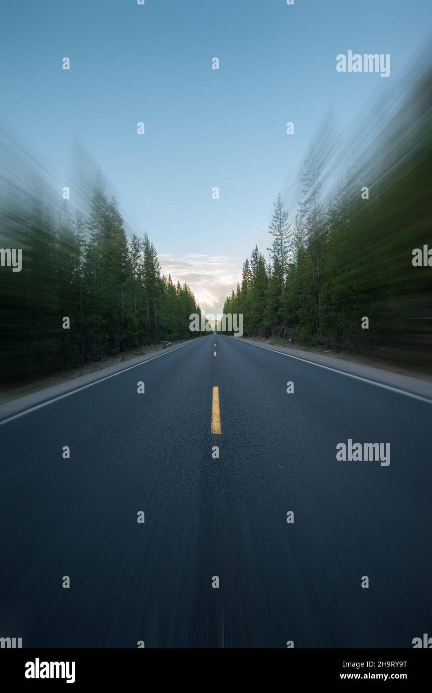 Highway Oregon diminishing perspective at dawn. Selective blur. Stock Photo