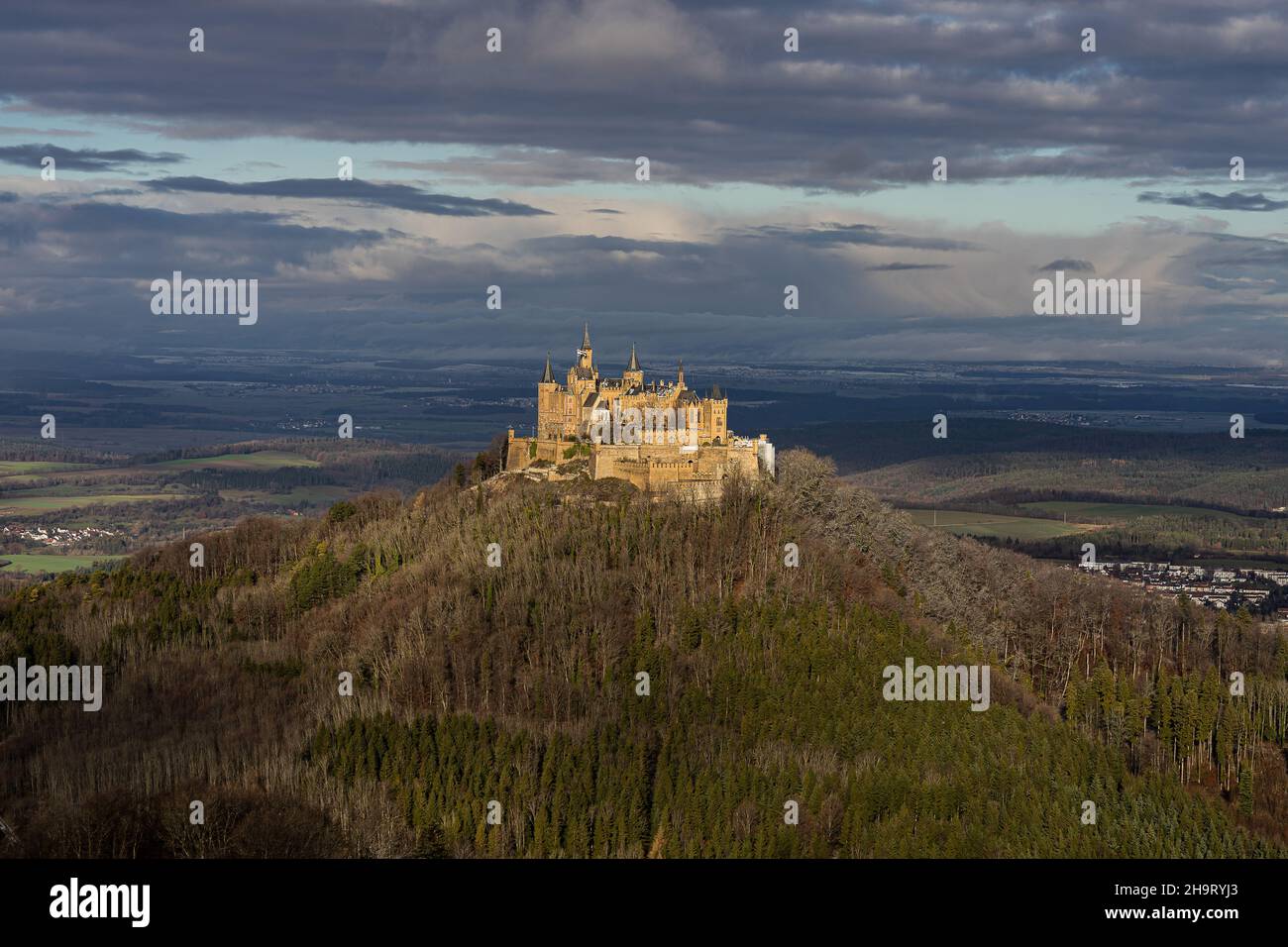 View from the Zellerhorn to Hohenzollern Castle with plays of light and a deep blue sky rich in contrasts in winter Stock Photo