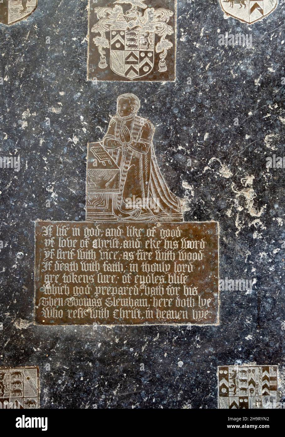 Church of Saint Lawrence, Brundish, Suffolk, England, UK memorial brass Thomas Glemham kneeling at a prayer desk 16th century Stock Photo