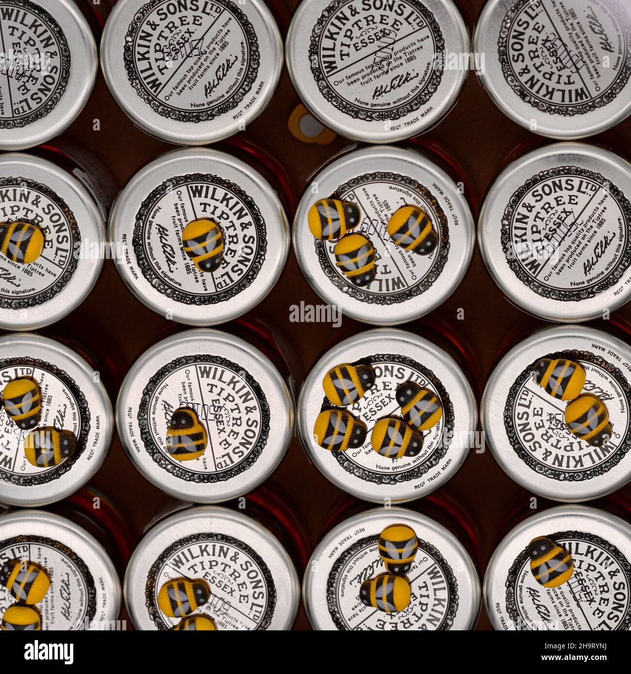 The lids of small 28g Tiptree honey jars from Wilkin and Sons Ltd. With