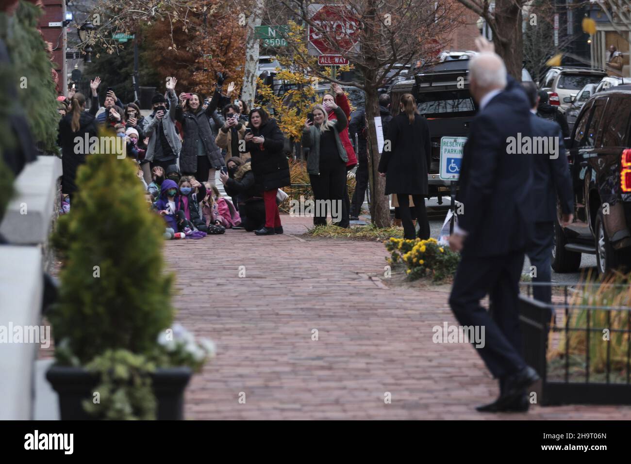 Washignton, United States. 08th Dec, 2021. President Joe Biden waves to a group of children as he arrives at the Holy Trinity Church in the Georgetown neighborhood of Washington, DC after attending mass there on Wednesday, December 8, 2021. Roman Catholics celebrate today the Feast of the Immaculate Conception. Photo by Oliver Contreras/UPI Credit: UPI/Alamy Live News Stock Photo