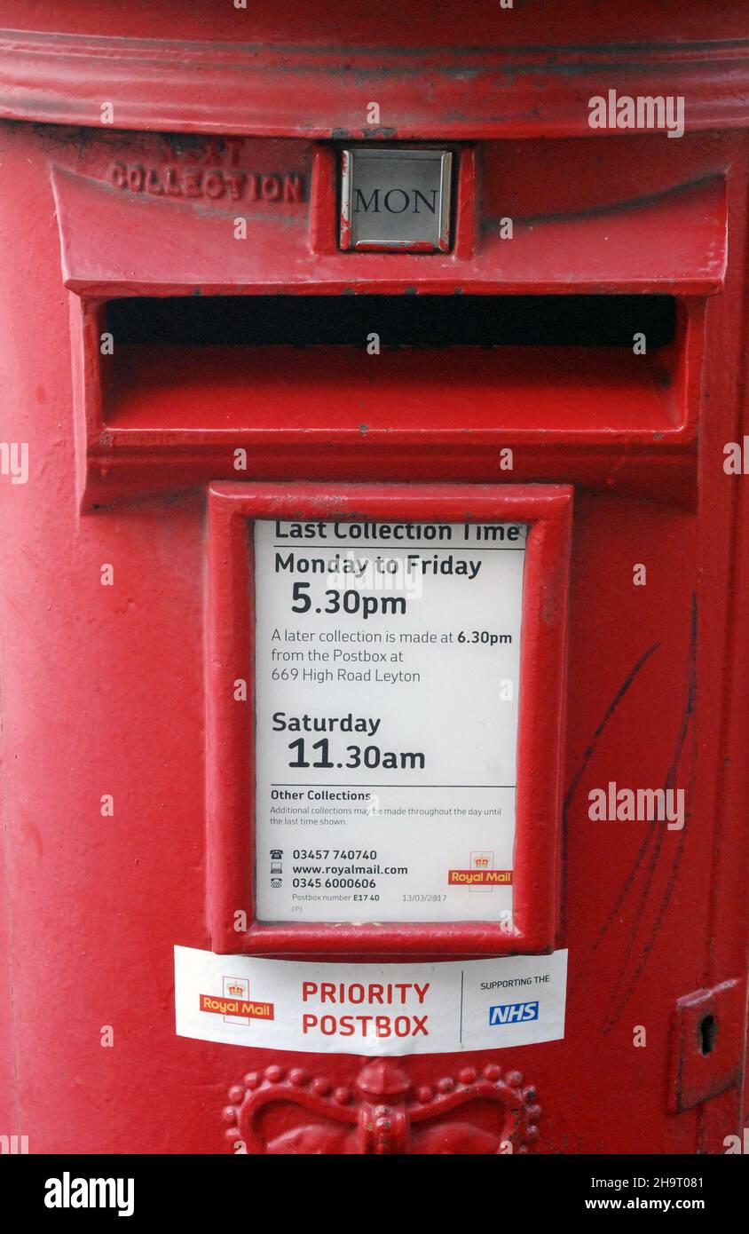Close-up, of a Covid-19, Coronavirus priority postbox, for fast collection of coronavirus tests. Red, EIIR Type B, Royal Mail, letter box, pillar box. Stock Photo
