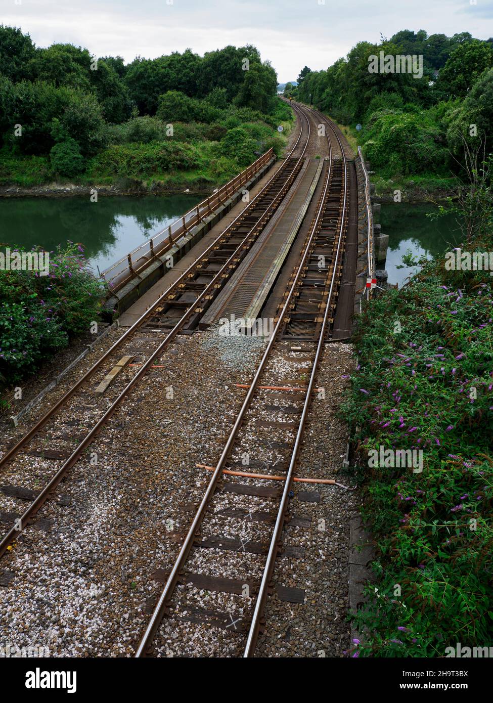Railway track going over a river, Plymouth, Devon, UK Stock Photo