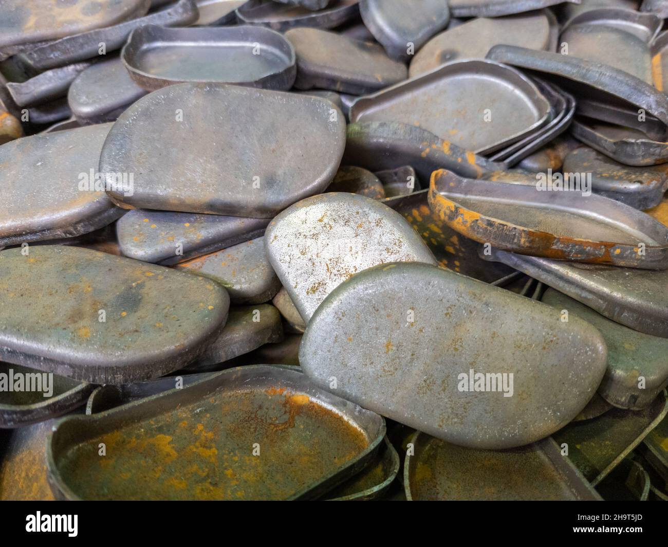 full frame background of many stamped parts made of sheet metal with