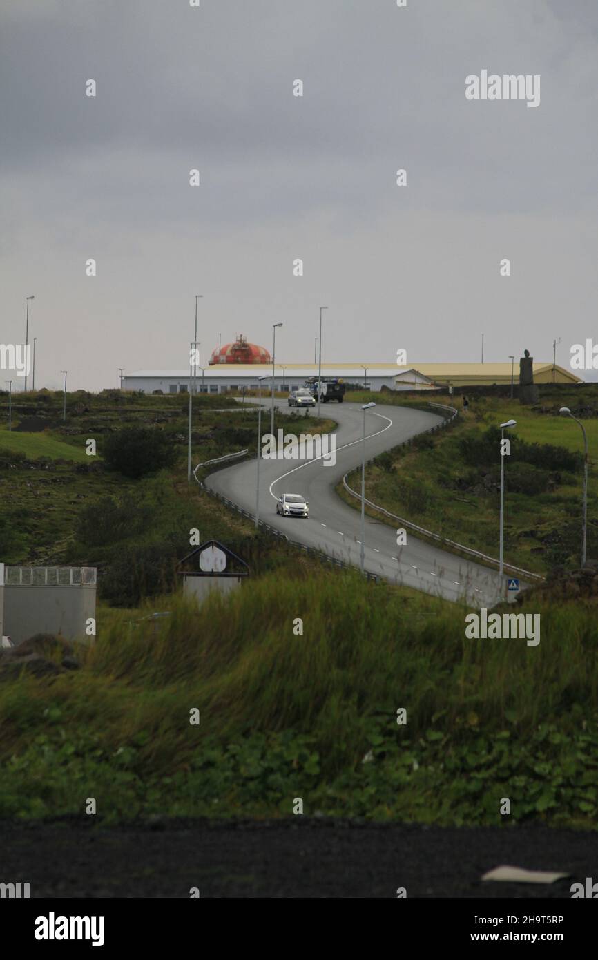 Vertical view of the rural road surrounded by green vegetation Stock ...