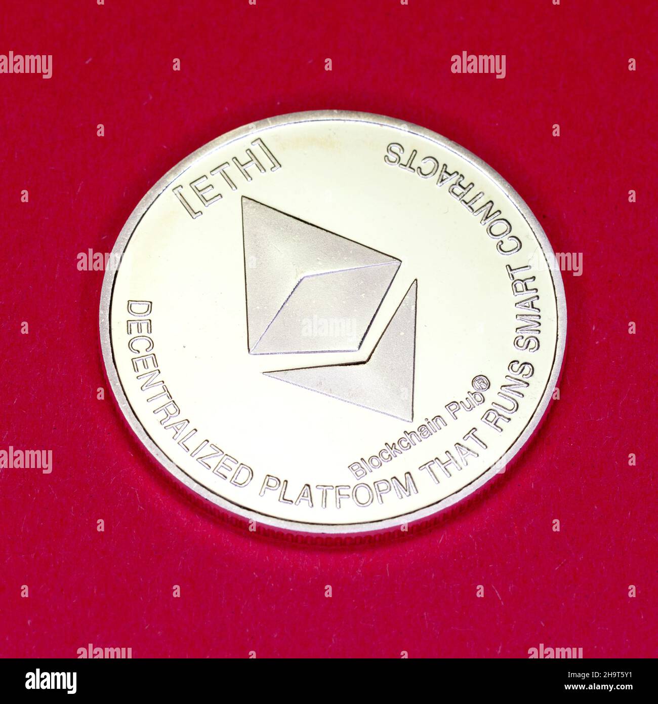 Cryptocurrency Ethereum physical coin. Stock Photo