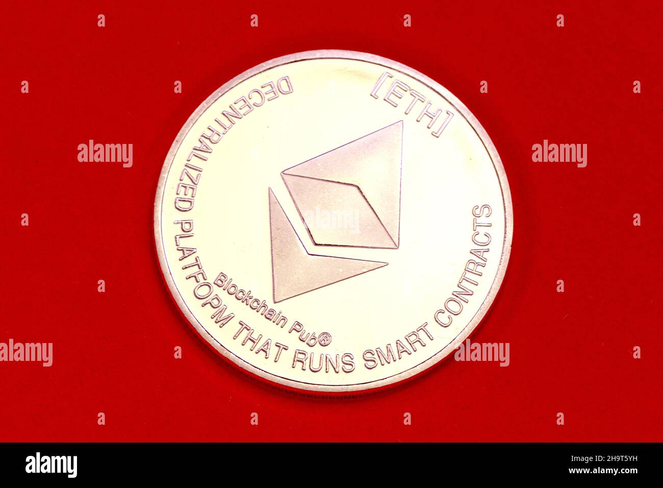 Cryptocurrency Ethereum physical coin. Stock Photo