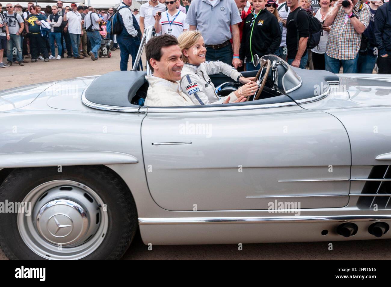 Toto Wolff and Susie Wolff at Goodwood Festival of Speed, UK, 2016, driving a Mercedes-Benz 300 SL through the crowd Stock Photo