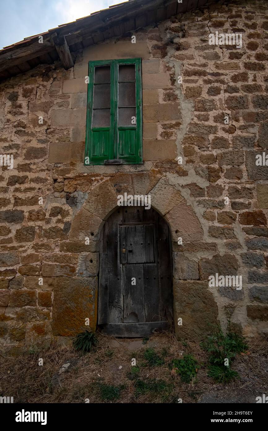 Door and window of a stone house in the town of La Serna del Ebro. Stock Photo
