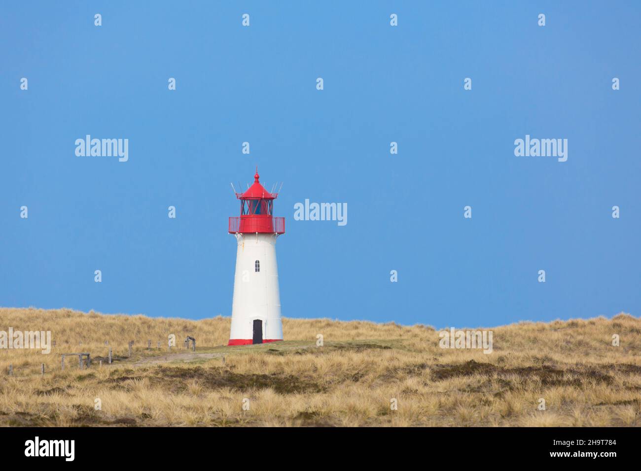 Red and white List-West lighthouse in the dunes on the island Sylt, North Frisia, Schleswig-Holstein, Germany Stock Photo