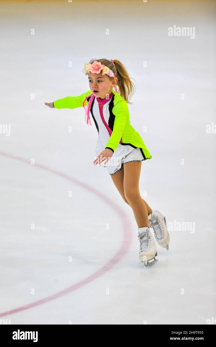 Little girl figure skater skating on ice indoor Stock Photo Alamy