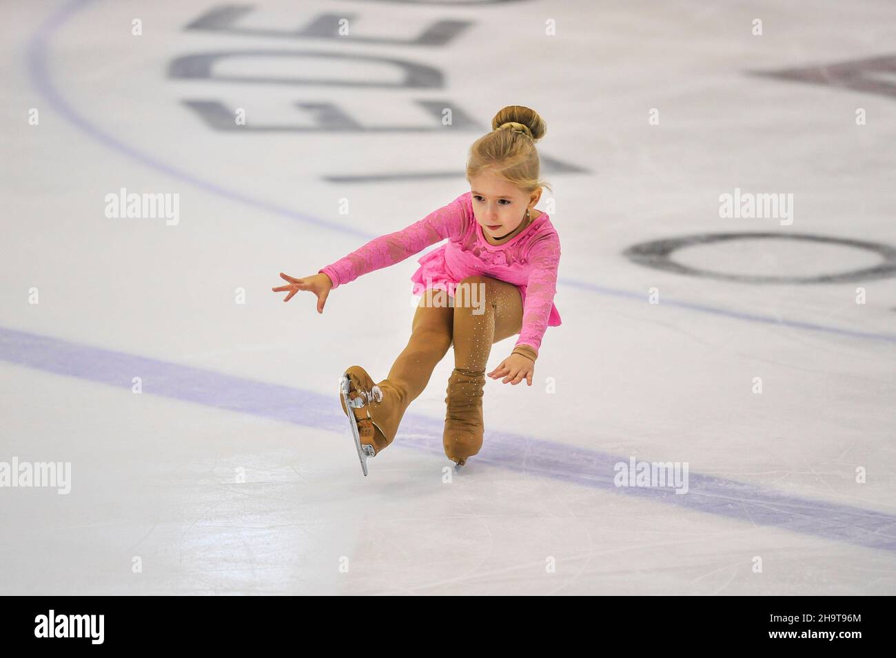 Little girl figure skater skating on ice indoor Stock Photo Alamy