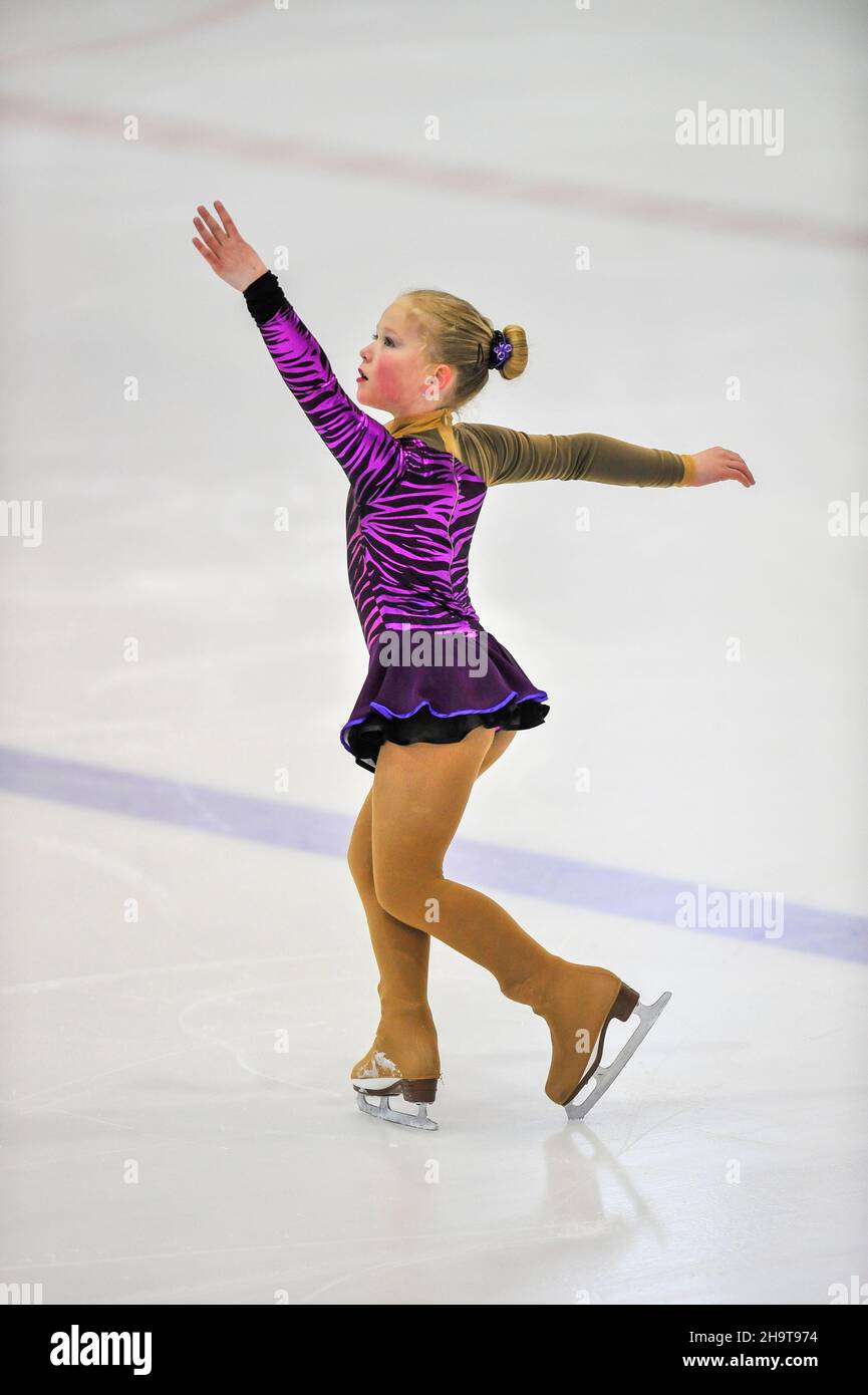 Little girl figure skater skating on ice indoor Stock Photo Alamy