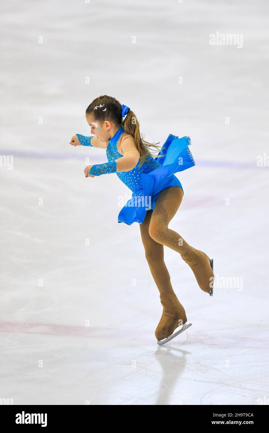 Little girl figure skater skating on ice indoor Stock Photo Alamy