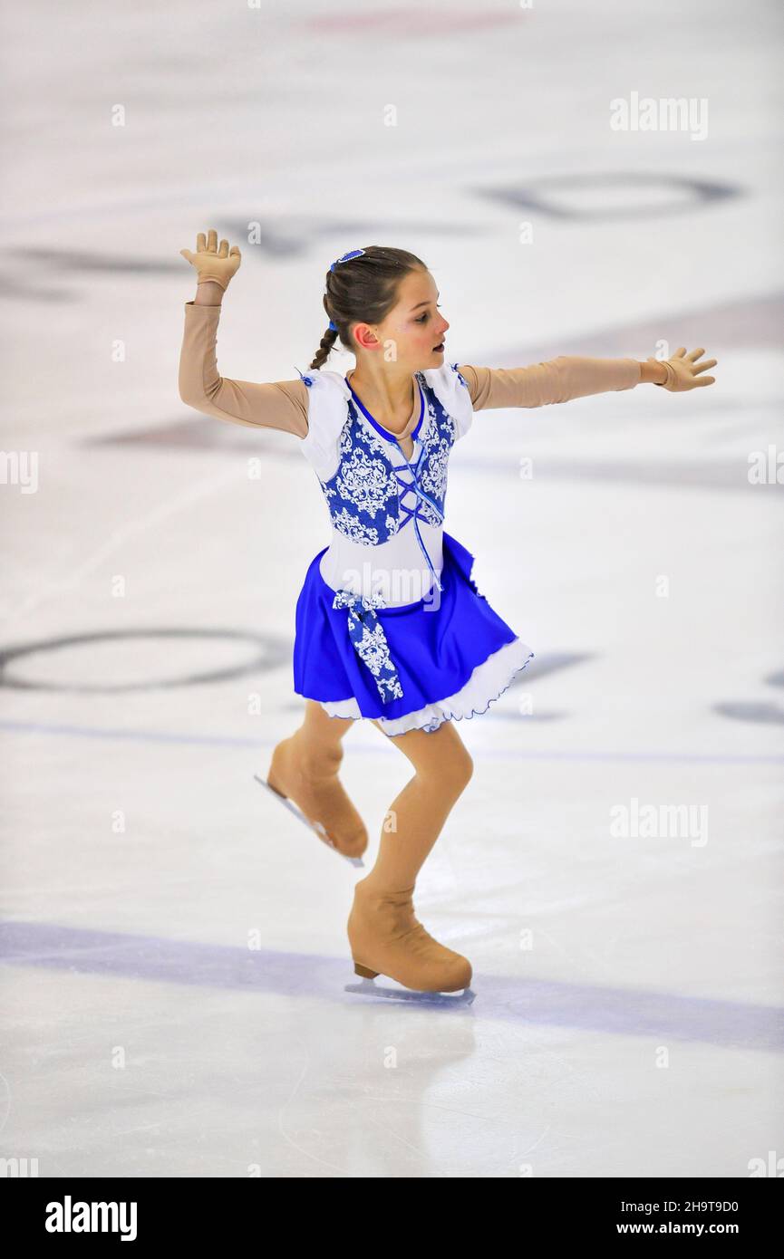 Little girl figure skater skating on ice indoor Stock Photo Alamy