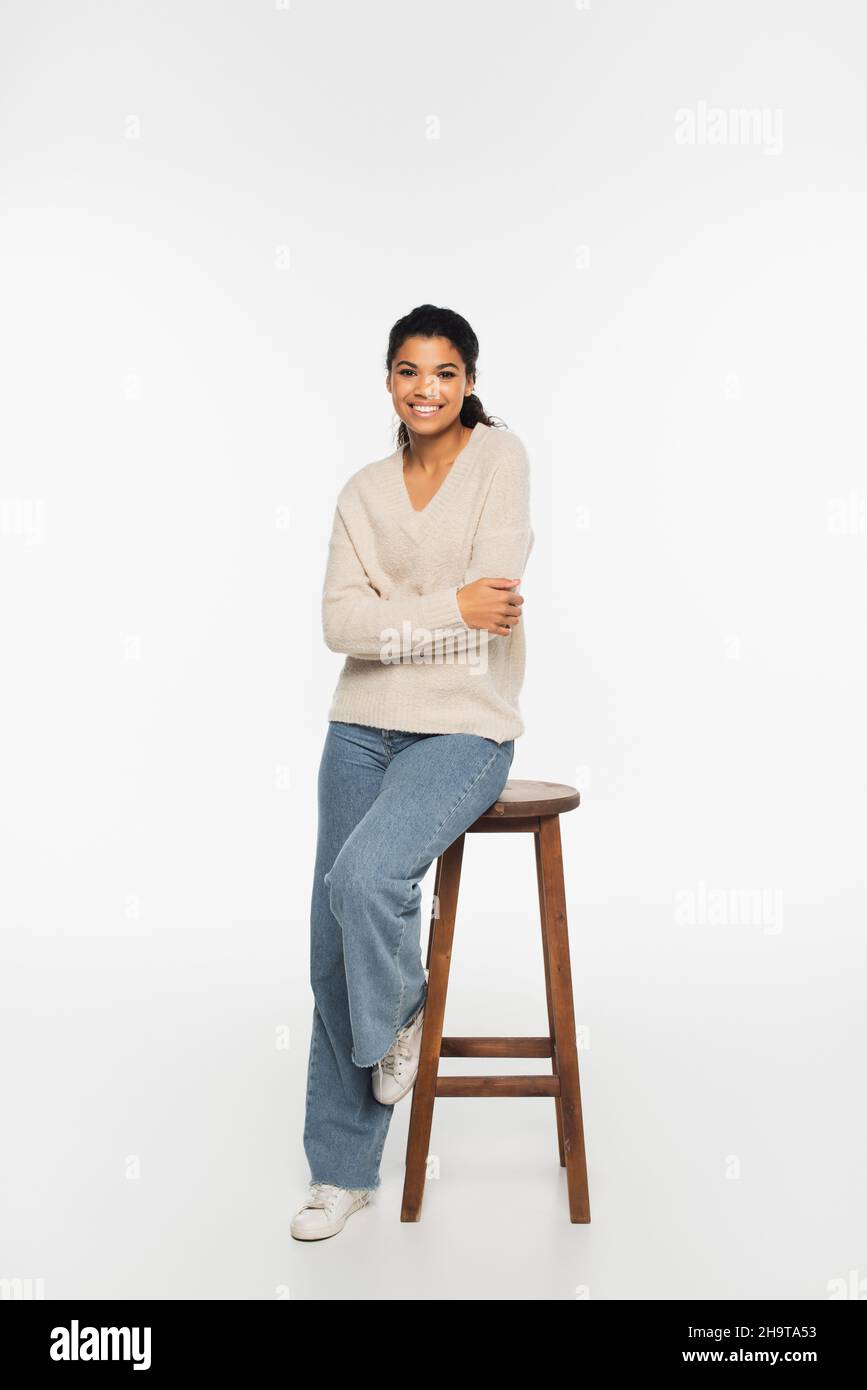 African american woman sitting on chair hi-res stock photography and ...