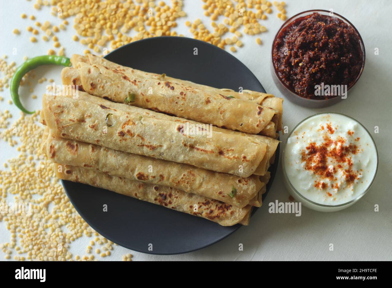Daal paratha served with garlic chutney and curd. Indian flatbread with lentils and spices. A protein rich version of Indian paratha served with condi Stock Photo