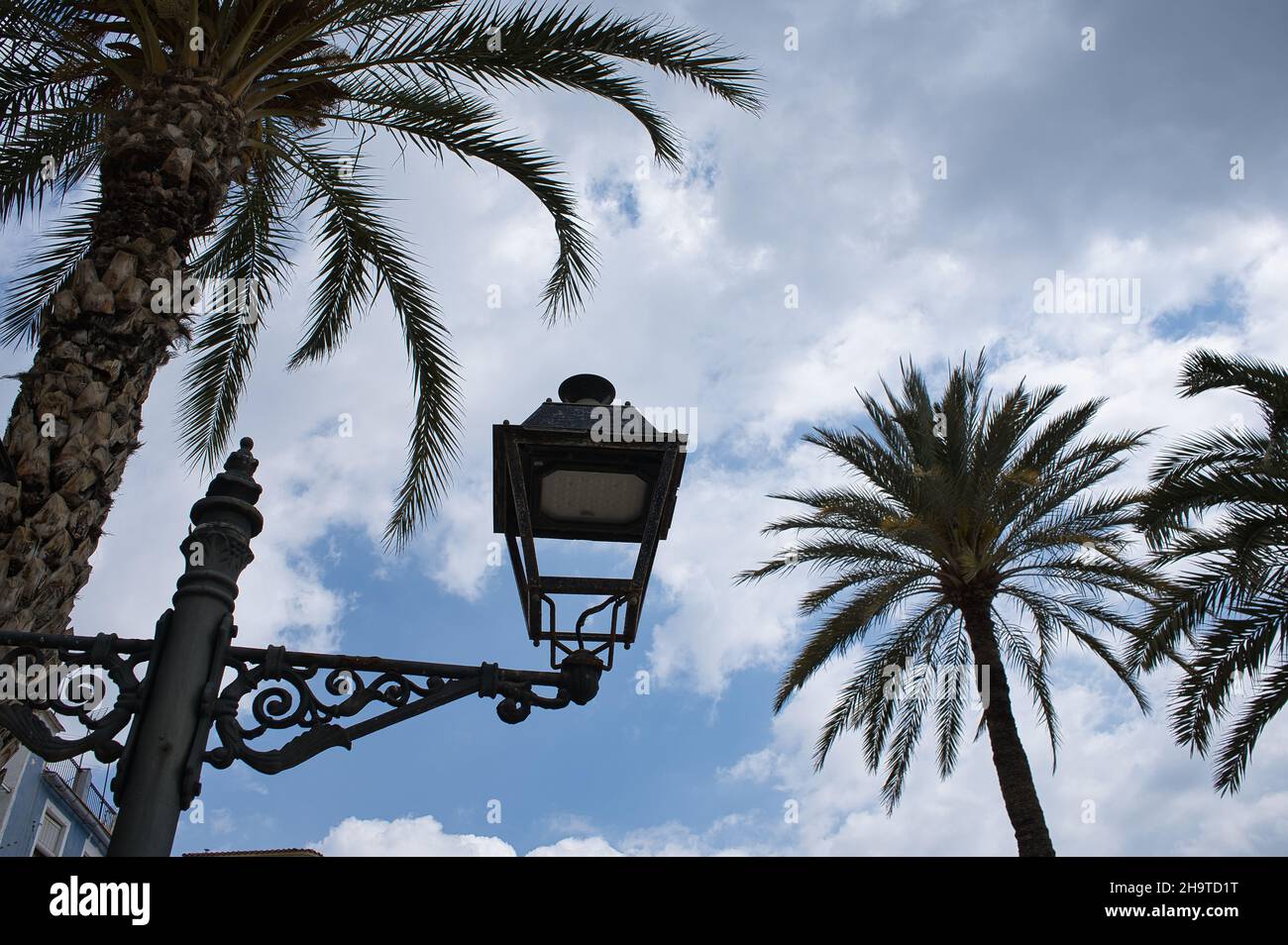 old street lamp on the street with clouds background, view Stock Photo