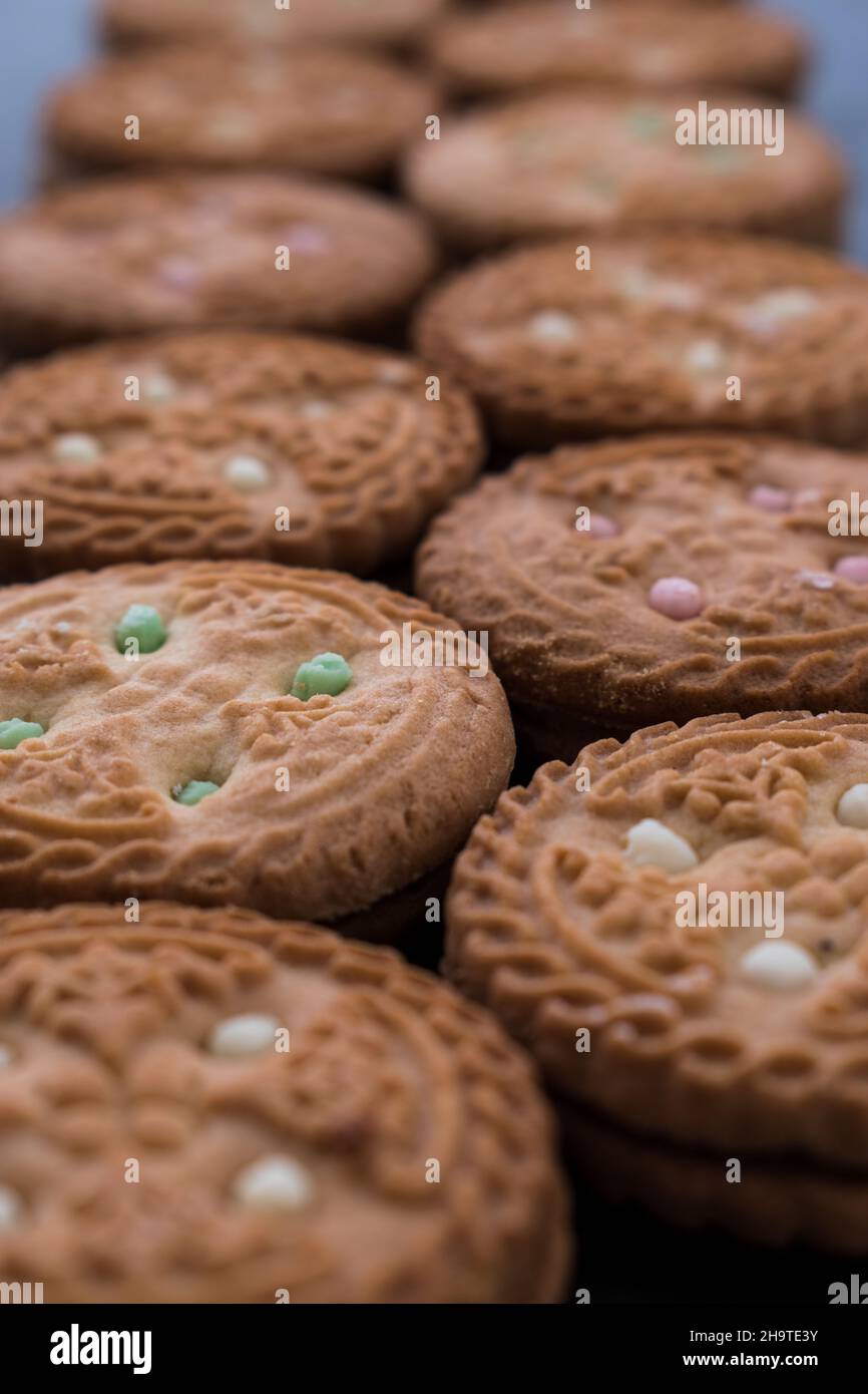 Some different cookies on a black wooden table Stock Photo