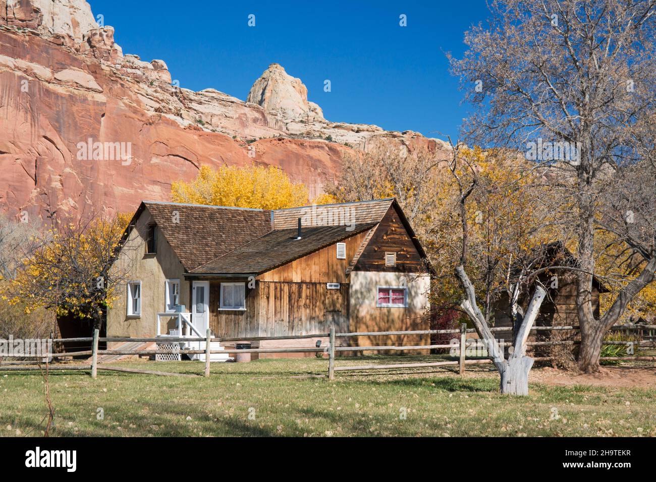 Fruita, Capitol Reef National Park, Utah, USA. Gifford House, part of the historic Gifford Homestead, autumn, cliffs of the Waterpocket Fold beyond. Stock Photo