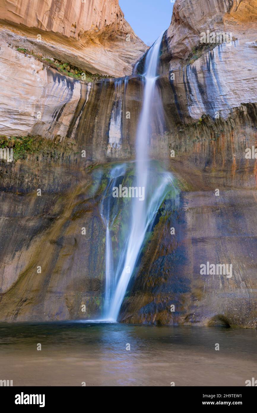 Grand Staircase-Escalante National Monument, Utah, USA. Lower Calf Creek Falls plunging into pool beneath high sandstone cliffs, autumn. Stock Photo