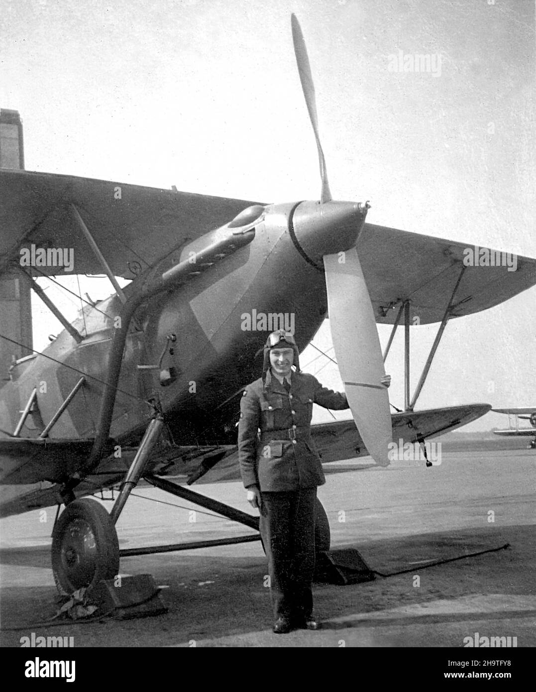 November 1938. RAF pilot with a Hawker Demon two-seat biplane fighter aircraft. The Demon was an interim fighter, replaced on the front-line by September 1939. Stock Photo