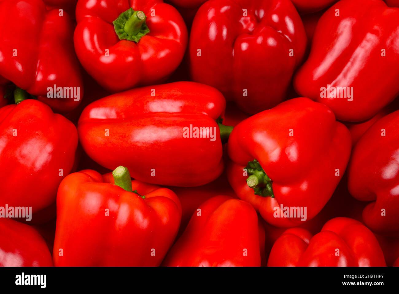 Fresh red bell pepper background Stock Photo - Alamy