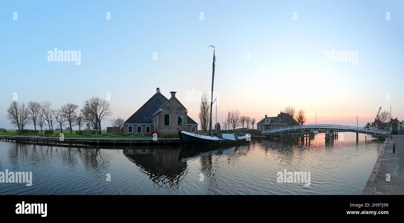 Gaastmeer after sunset with an old ship at the shore, Netherlands, Frisia Stock Photo