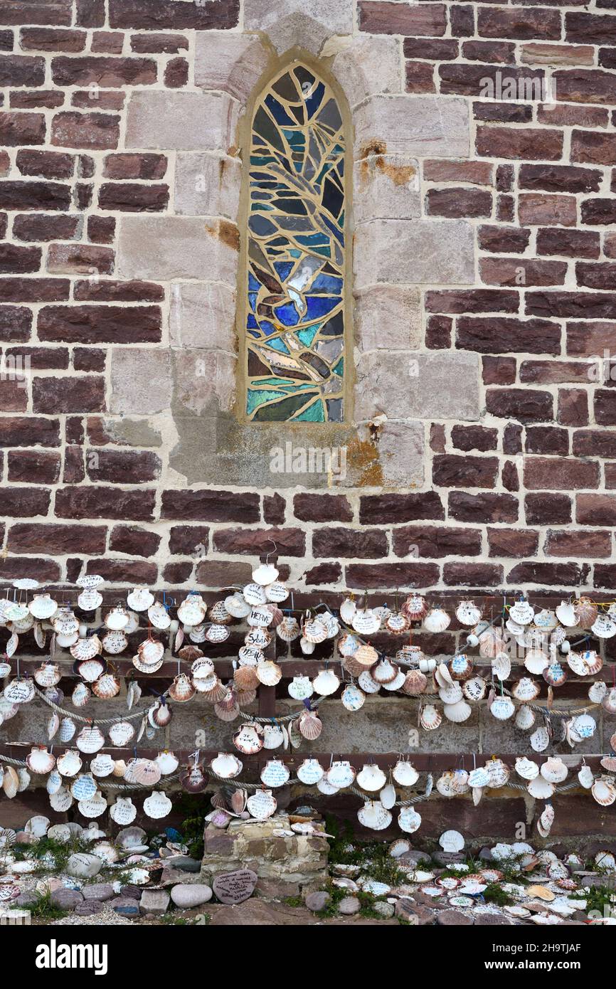 St.James's scallop, great scallop (Pecten jacobaeus), inscribed Jacob pilgrim shells hanging on the outside of the wall of the Chapel of Saint Stock Photo