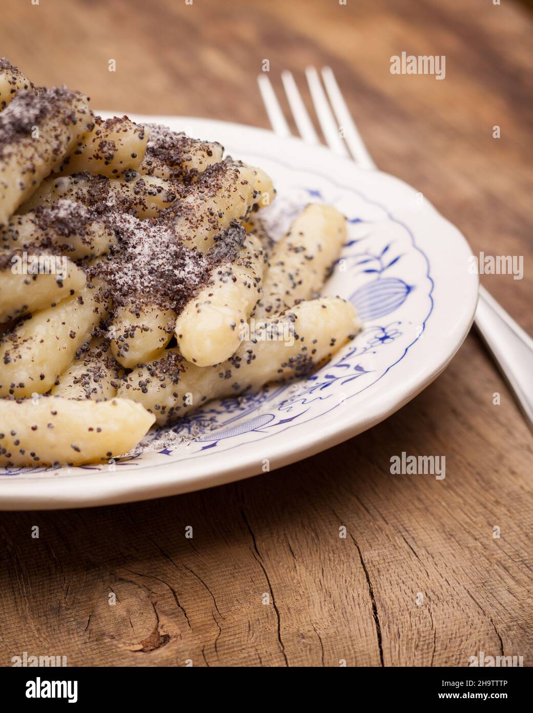 poppy seed noodles, wood, table, pasta, Austria, sweet, dish, poppy, typical, dessert, potato, bread crumbs, pastries, icing sugar, white, wooden tabl Stock Photo