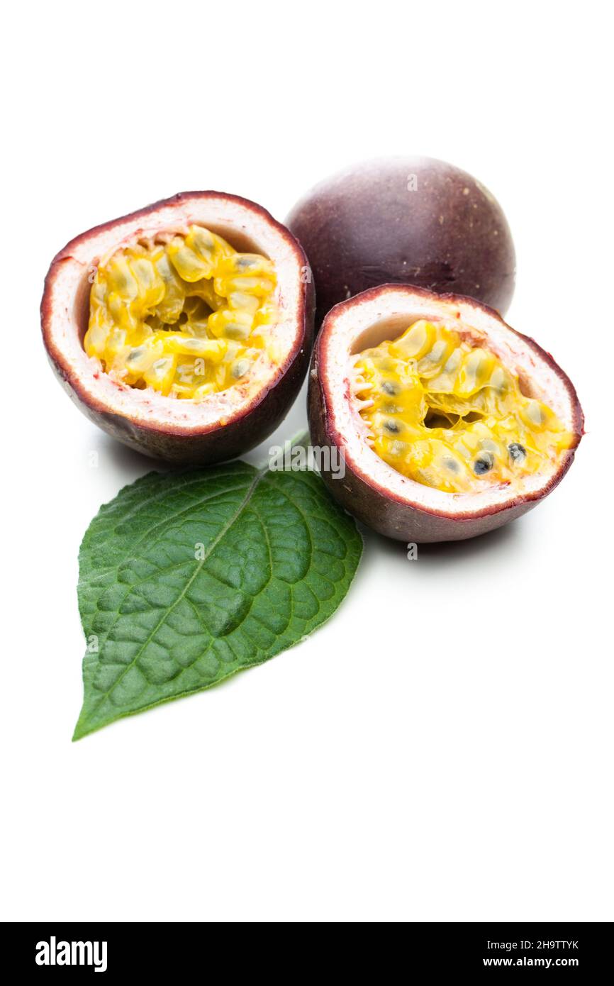 passion fruit, leaf, open, white, half, heart, shadow, tropical, lying, halves, isolated, flesh, together, purple, fruit, background, natural, mature, Stock Photo