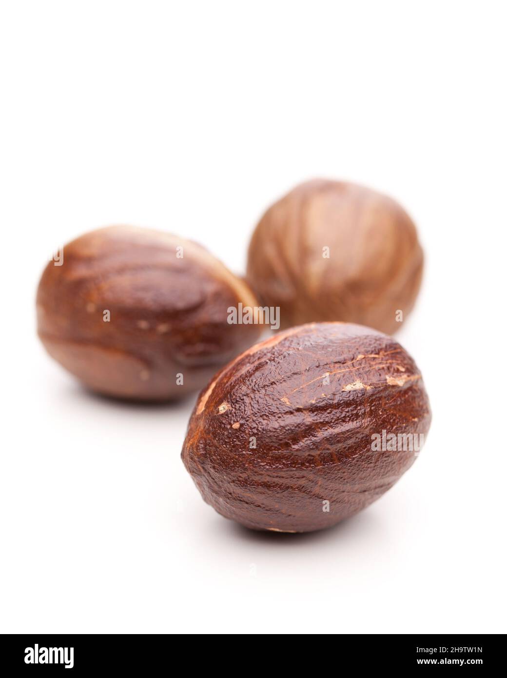 nutmeg, nuts, whole, details, background, close-up, one behind the other, white, behind, spice, nut, smooth, back, detail, isolated, brown, surface, b Stock Photo